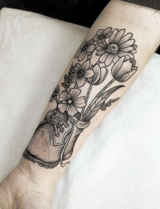 Boot and flower tattoo