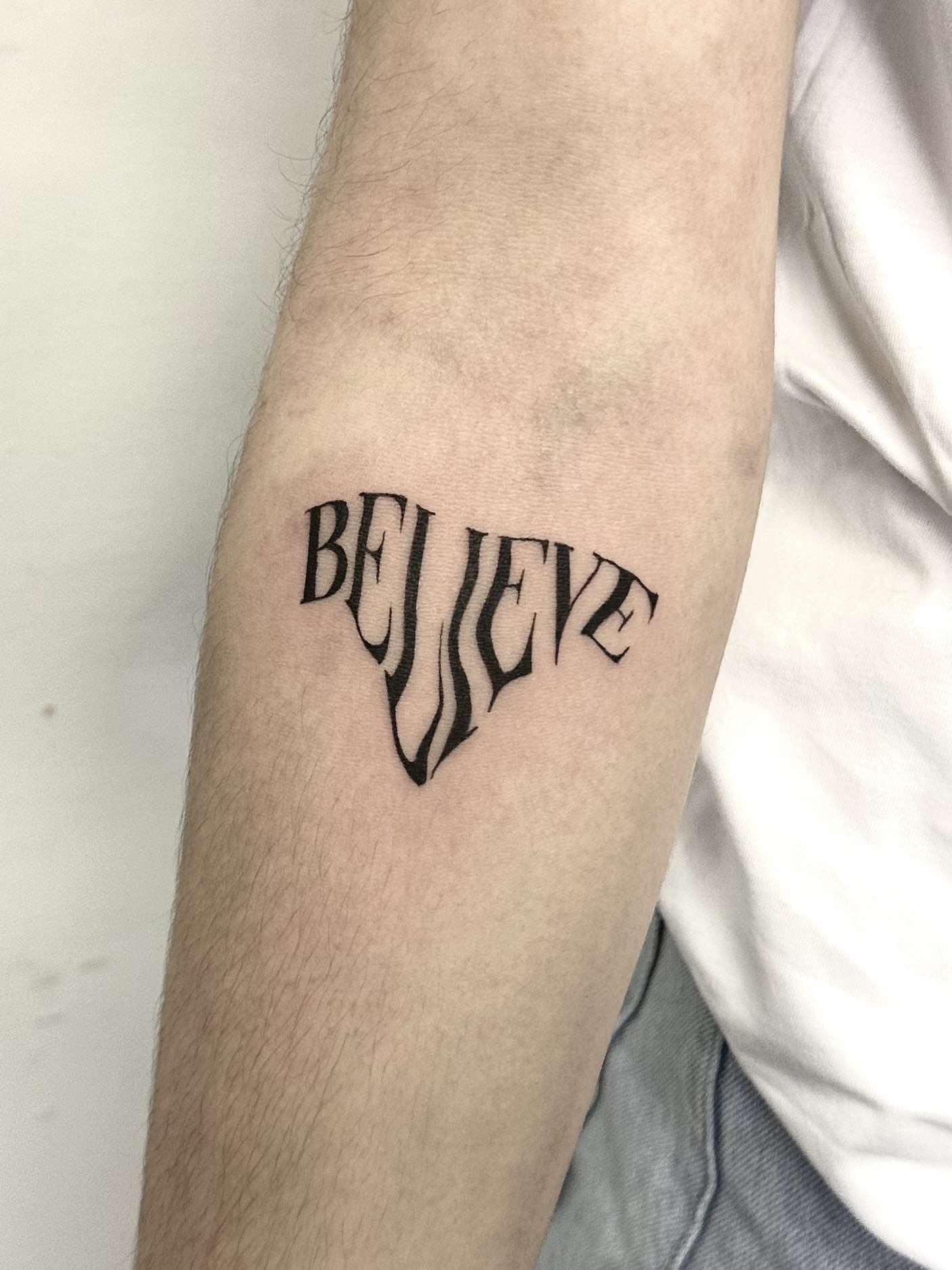 Tatouage believe – Lab Tattoo Lausanne